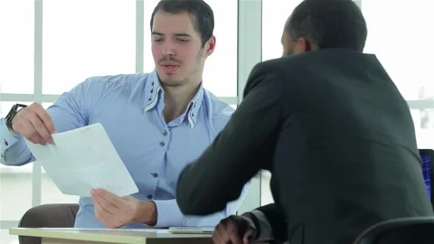 Businessmen collaborating on a strategic plan Stock Footage 311817152