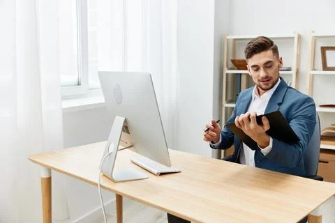 Businessmen computer desktop work self-confidence paper folder Gray background Stock Photos