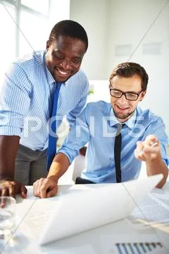Businessmen discussing results of the year Stock Photos