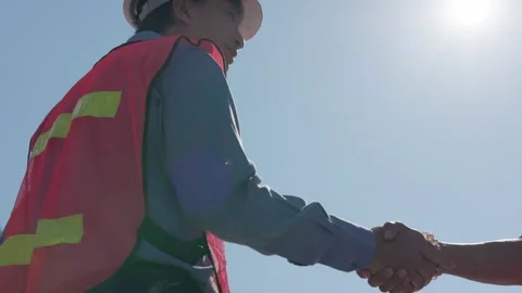 Businessmen Engineers shake hands as they load a container from a container y Stock Footage 167869077