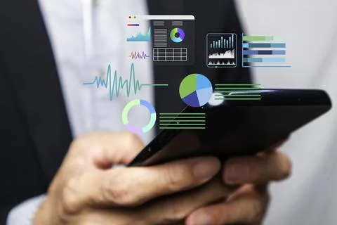 Businessmen examine digital data to use in their technology business. Stock Photos