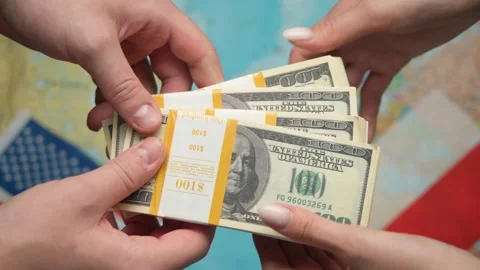 Businessmen exchange stack of dollars against US and Polish flags with world map Stock Footage 331261244