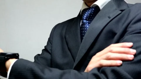 Businessmen getting irritated while waiting for someone Stock Footage 336387333