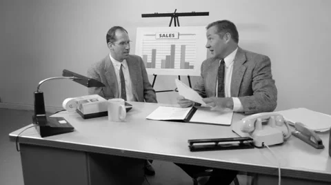 Businessmen going over reports Stock Footage 61671990
