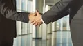 The businessmen handshake in the office. slow motion HD Footage