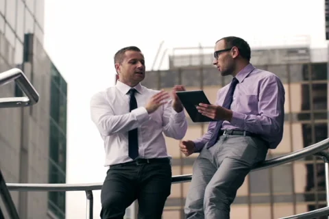 Businessmen having quarrel and using tablet Stock Footage 44220527