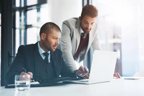 Businessmen, laptop and problem solving for collaboration in office, accounting Foto stock
