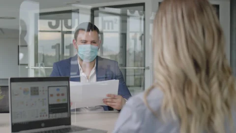 Businessmen with masks have a meeting at the time of the corona virus Stock Footage