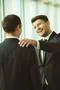 The businessmen pat on the shoulder in the office Photo