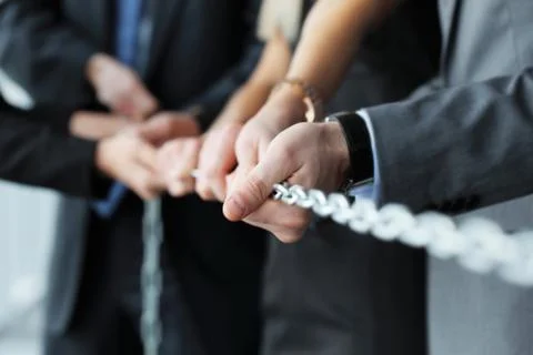 Businessmen pulling chain Stock Photos