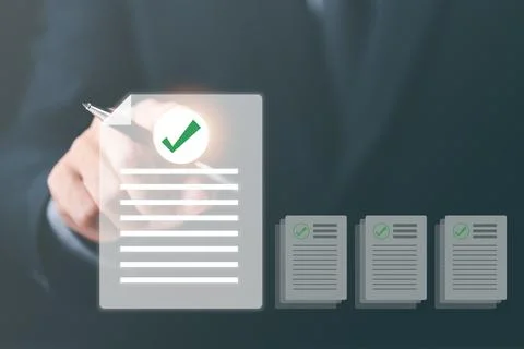Businessmen review procedures through documents containing checkbox lists, .. Stock Photos