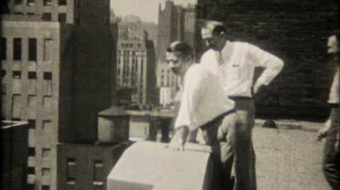 Businessmen on rooftop see Chicago skyline 1950s vintage film home movie 2079 Stock Footage