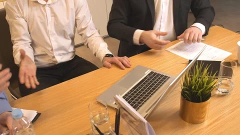 Businessmen shake hands decisively at the table sealing the deal. Businessmen Stock Footage 272478048