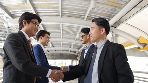 Businessmen shaking hands Stock Footage 87002574