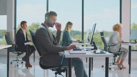 Businessmen sitting in shared office Stock-Footage 164568484