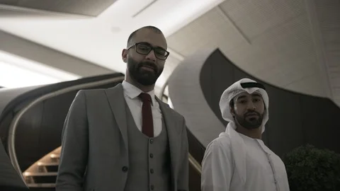 Businessmen by a staircase Video stock 108492563