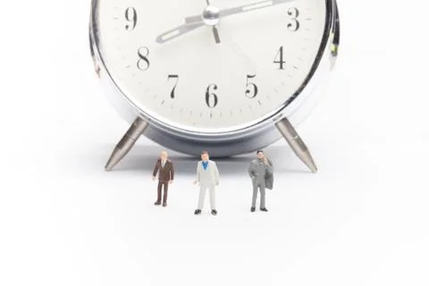 Businessmen standing in front of the clock Stock Photos