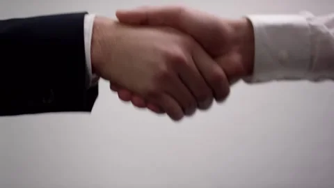 Businessmen in Suits Shaking Hands, Gray Background, Close Up Studio Shot 動画素材 341532083