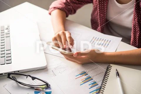 Businessmen use smartphones and laptop to connect and find infor Stock Photos