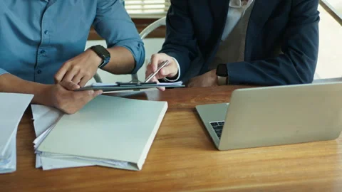 Businessmen using digital tablet planning investment project at meeting table Stock Footage 266418134