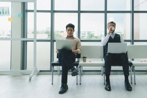 Businessmen using laptop computers in office. 스톡 사진