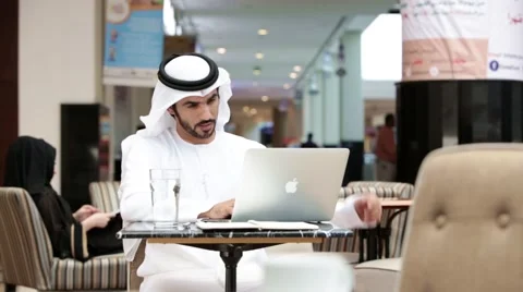 Businessmen using laptop at restaurant. Stock Footage 57337656