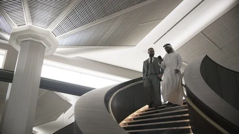 Businessmen walking down the staircase Stock Footage 108493557