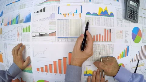  Businessmen working on charts Stock Footage 210483749