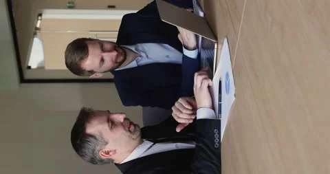 Businessmen working on collaborative project, develop marketing strategy use Stock Footage 229682901