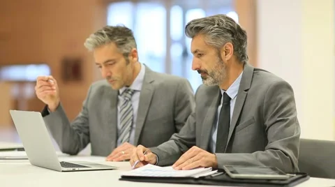Businessmen working on laptop computer Stock Footage 49036398