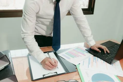 Businessmen working in modern creative studios Use a Generic Laptop Design An Stock Photos