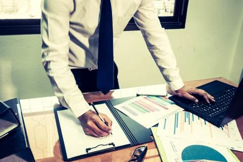 Businessmen working in modern creative studios Use a Generic Laptop Design An Stock Photos