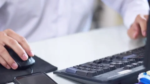 Businessmen working in the office, using computer searches new job on interne Stock Footage 114900627