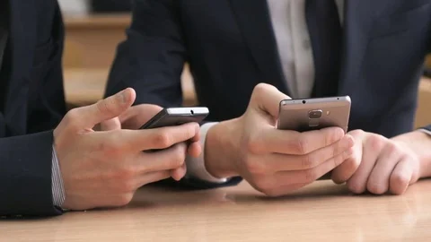 Businessmen writes the text using mobile phones Stock Footage 79546163