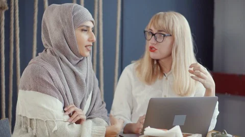 Businessowomen having a conversation in a cafe. Stock Footage 107741852