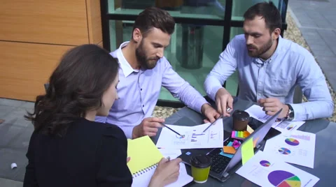 Businesspartners talking in the street Stock Footage 64285846
