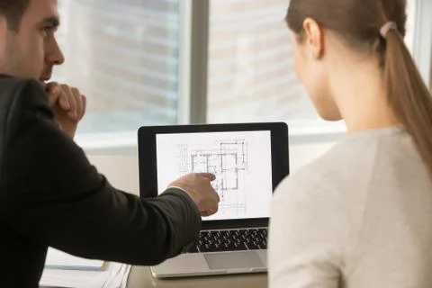 Businesspeople discussing home remodeling, building project plan Stock Photos