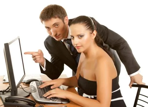 Businesspeople discussing while working at the computer Stock Photos