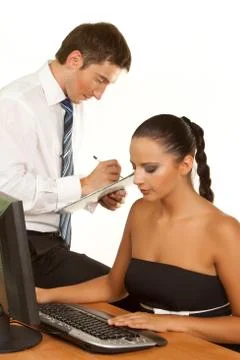 Businesspeople discussing while working at the computer Stock Photos