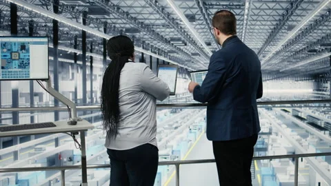 Businesspeople in microelectronics smart factory develop technology roadmaps Stock Footage 333379965