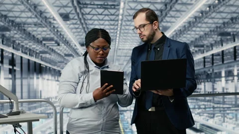 Businesspeople in microelectronics smart factory develop technology roadmaps Stock Footage 333384953