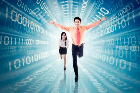 Businesspeople running inside binary code 스톡 사진