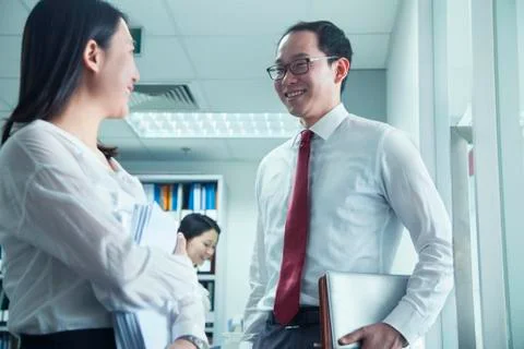 Businesspeople Talking at Work Stock Photos