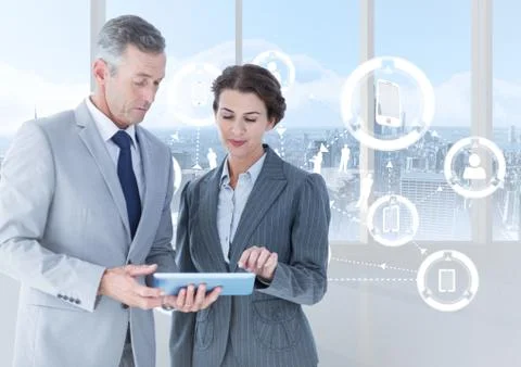 Businesspeople using digital tablet with multiple models interface against Stock Photos