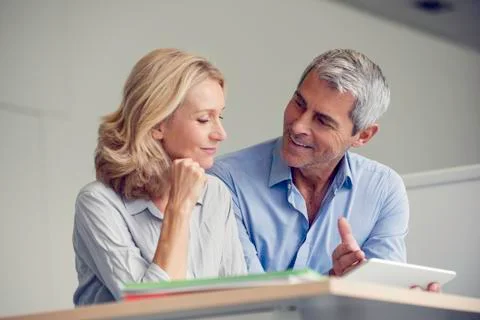 Businesspeople using digital tablet Stock Photos