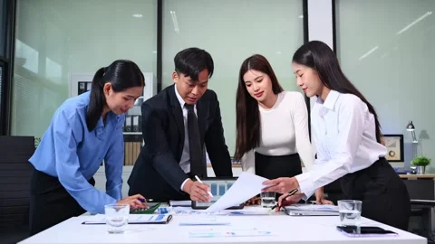 Businesspeople while collaborating on a new project in an office. Group of .. Stock Footage 313857934
