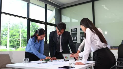 Businesspeople while collaborating on a new project in an office. Group of .. Video stock 313857944