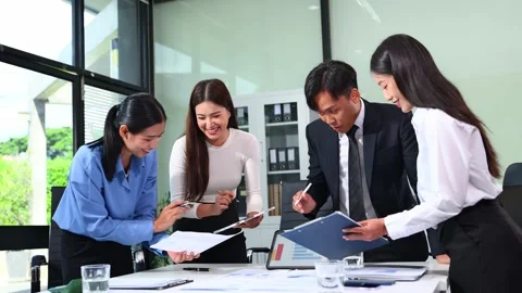 Businesspeople while collaborating on a new project in an office. Group of .. Video stock 313857967