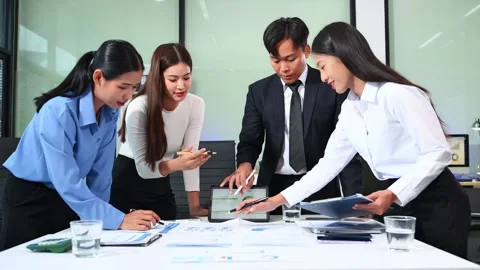 Businesspeople while collaborating on a new project in an office. Group of .. Video stock 313857973