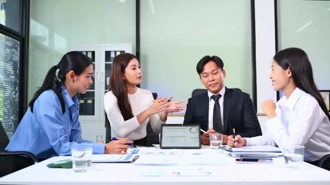 Businesspeople while collaborating on a new project in an office. Group of .. Video stock 313857997